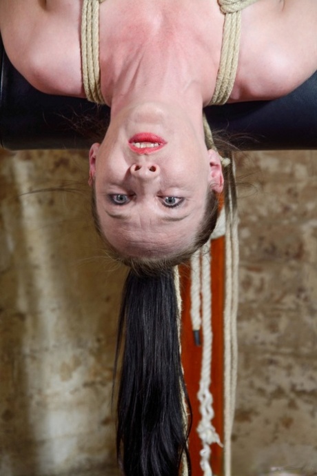 Female sub Lolani gets tied up in rope bondage while upside down