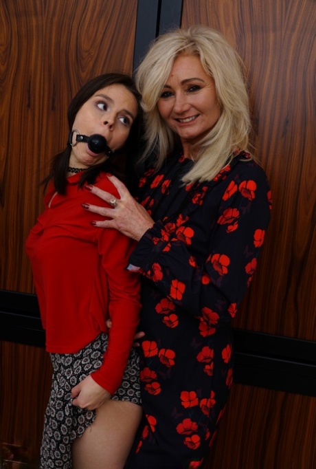 Amateur lesbians Ellen B and Ole Nina enjoy a hot bondage game with a strapon