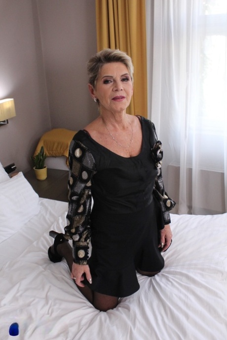 Mature beauty Irenka shows off her big ass and toys her hot pussy