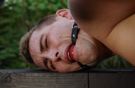 Romanian femdom Sandra Romain slaps and fucks her slave's ass on the bridge