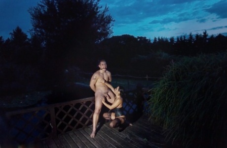 Romanian femdom Sandra Romain slaps and fucks her slave's ass on the bridge