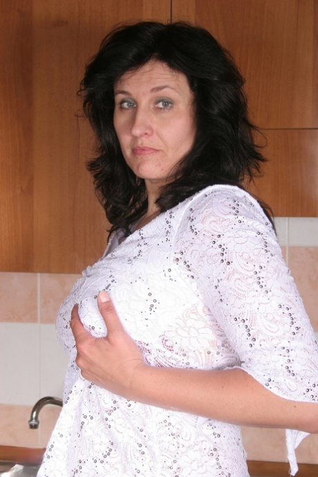 Curvy amateur mom Marietta exposes her big tits and ass before toying her cunt