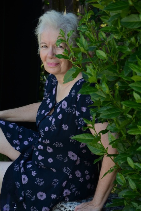 Big boobed granny Caroline stripping on the swing and toying her fat pussy